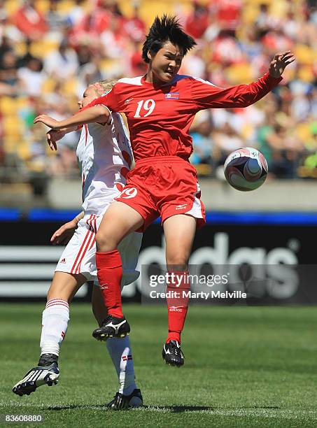 Jang Hyon Sun of Korea jumps for the ball with Line Sigvardsen Jensen captain of Denmark during the FIFA U-17 Women`s World Cup Quarter final match...