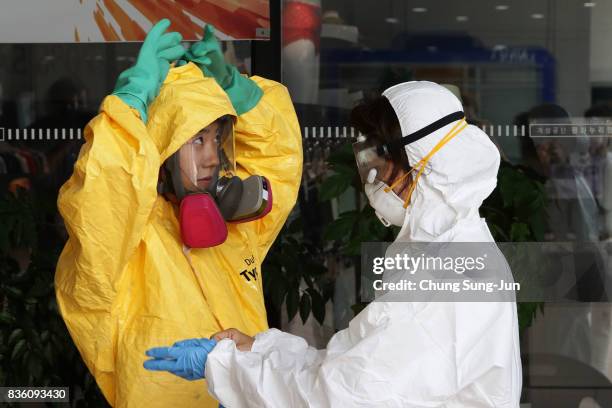 Emergency services personnel wearing protective clothing participate in an anti-terror and anti-chemical terror exercise as part of the 2017 Ulchi...