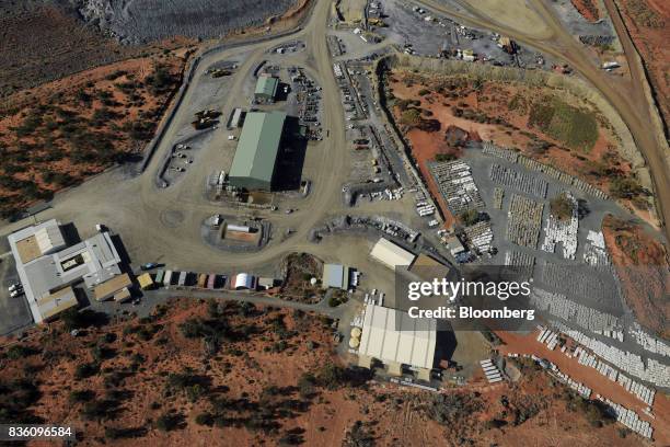 Trays of core samples line the core yard, right, at Evolution Mining Ltd.'s gold operations in this aerial photograph taken above Mungari, Australia,...