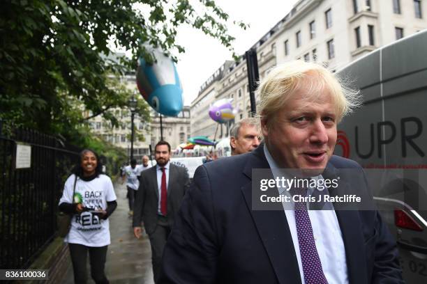 Boris Johnson, Secretary of State for Foreign and Commonwealth Affairs passes Greenpeace protestors near the BP headquarters during a protest in St....