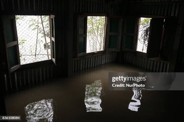 An inside view of a submarged house in Jamalpur, Bangladesh, on 19 August 2017.