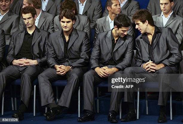 Tennis players Novak Djokovic of Serbia and Juan Martin del Porto of Argentina chat while Andy Murray of Britain and Roger Federer of Switzerland...