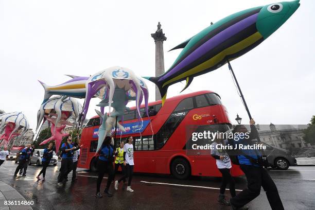 Greenpeace protestors pass into Trafalgar Square as they take part in a parade of inflatable sea creatures on August 21, 2017 in London, England. The...