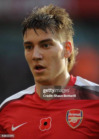 Nicklas Bendtner of Arsenal wears a shirt with an embroidered... News