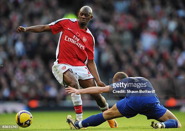 Abou Diaby of Arsenal evades Nemanja Vidic of Manchester United during the Barclays Premier League match between Arsenal and Manchester United at the...