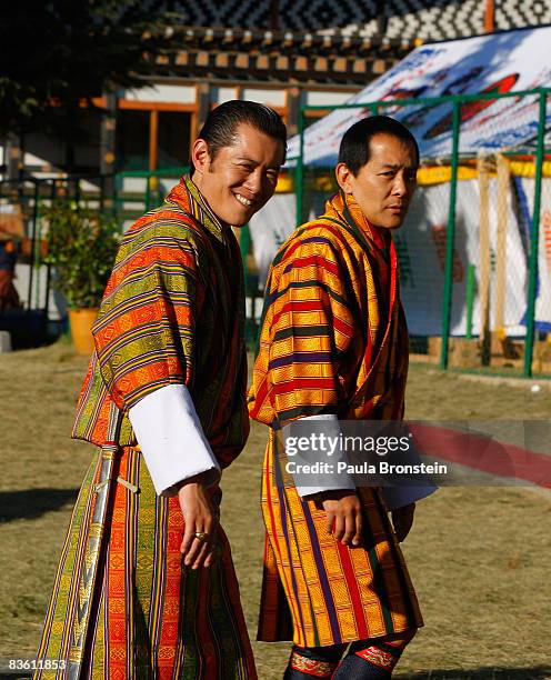 His Majesty Jigme Khesar Namgyel Wangchuck walks along side his father, former King Jigme Singye Wangchuck as they leave during a coronation...