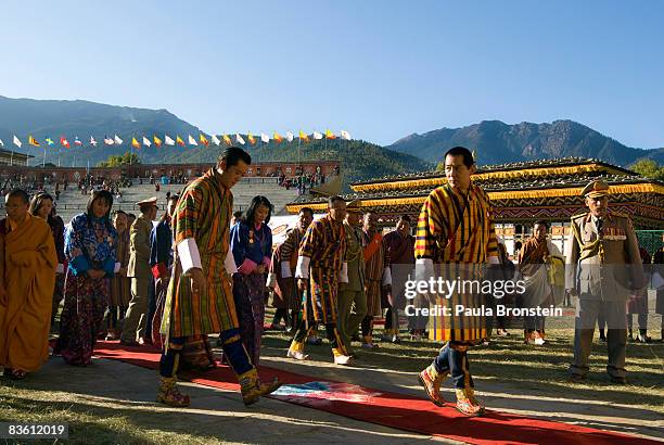 His Majesty Jigme Khesar Namgyel Wangchuck walks behind his father, former King Jigme Singye Wangchuck as they leave during a coronation celebration,...