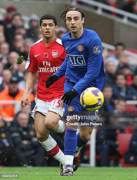 Dimitar Berbatov of Manchester United clashes with Denilson of Arsenal during the Barclays Premier League match between Arsenal and Manchester United...