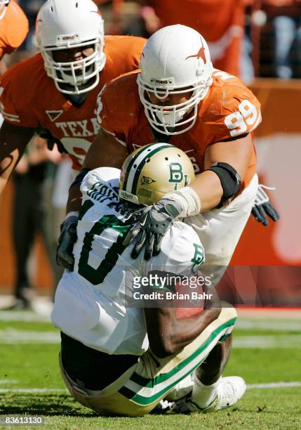 Defensive tackle Roy Miller of the Texas Longhorns sacks quarterback Robert Griffin of the Baylor Bears in the second quarter on November 8, 2008 at...
