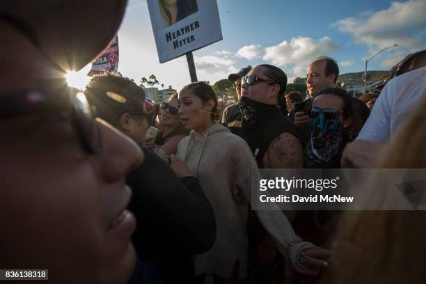 Demonstrators argue with counter demonstrators during an 'America First' demonstration on August 20, 2017 in Laguna Beach, California. Organizers of...