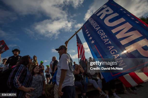 Conservative demonstrators rally at an 'America First' demonstration on August 20, 2017 in Laguna Beach, California. Organizers of the rally describe...