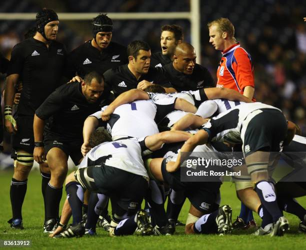 John Afoa, Cory Flynn and Neemia Tialata of the All Blacks pack down in the scrum during the match between Scotland and New Zealand at Murrayfield on...