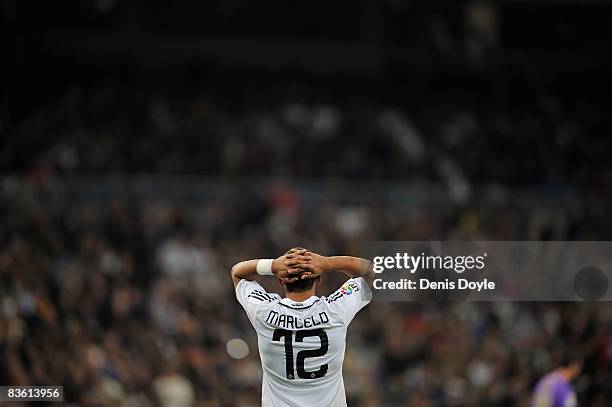 Marcelo of Real Madrid reacts after missing a goalscoring opportunity during the La Liga match between Real Madrid and Malaga at the Santiago...