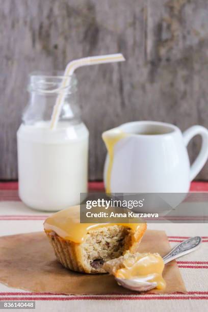 sticky date pudding topped with caramel sauce served with fresh milk, selective focus - toffee stock pictures, royalty-free photos & images