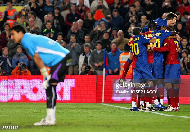 Barcelona's Icelandic Eidur Gudjohnsen is congratuled by teammates after scoring against Valladolid during their Liga football match on November 8,...