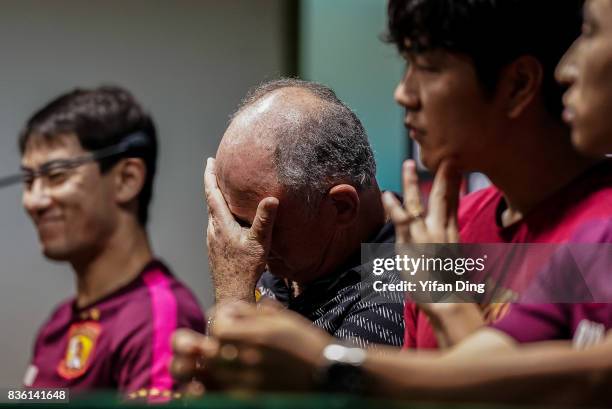 Luiz Felipe Scolari headcoach of Guangzhou Evergrande and Kim Young-Kwon of Guangzhou Evergrande react during pre-match press conference of the AFC...