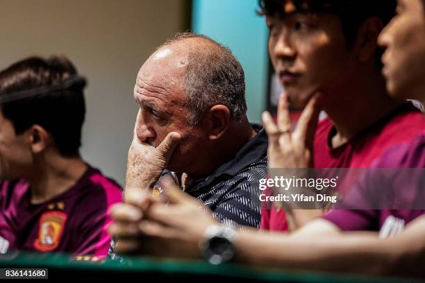 Luiz Felipe Scolari headcoach of Guangzhou Evergrande and Kim Young-Kwon of Guangzhou Evergrande react during pre-match press conference of the AFC...