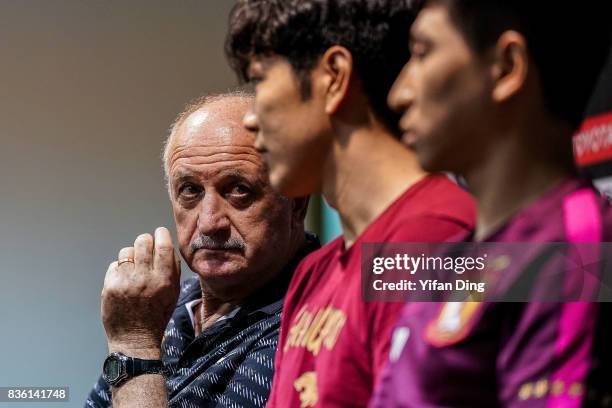 Luiz Felipe Scolari headcoach of Guangzhou Evergrande and Kim Young-Kwon of Guangzhou Evergrande react during pre-match press conference of the AFC...