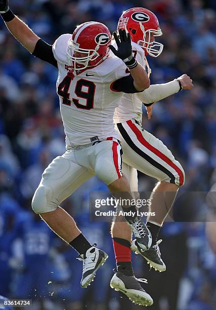 Shaun Chapas and Matthew Stafford of the Georgia Bulldogs celebrate after throwing the game winning touchdown against the Kentucky Wildcats at the...