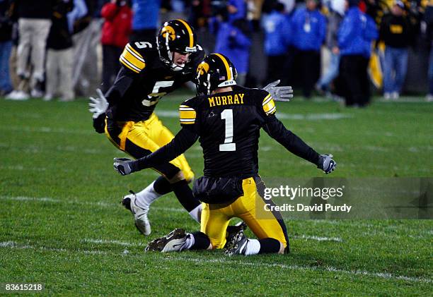 Iowa Kicker Daniel Murray celebrates with teammate Ryan Donahue after kicking the game winning field goal defeating Penn State Nittany Lions with six...