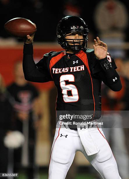 Quarterback Graham Harrell of the Texas Tech Red Raiders drops back to pass against the Oklahoma State Cowboys at Jones AT&T Stadium on November 8,...