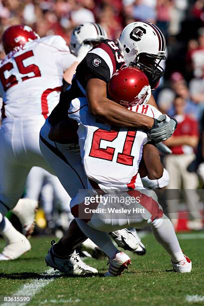 Cliff Matthews of the South Carolina Gamecocks tackles Michael Smith of the Arkansas Razorbacks at Williams-Brice Stadium on November 8, 2008 in...