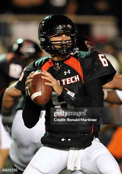 Quarterback Graham Harrell of the Texas Tech Red Raiders drops back to pass against the Oklahoma State Cowboys at Jones AT&T Stadium on November 8,...