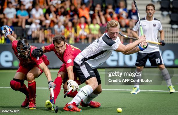 Michael Korper of Austria scores a goal past Austrian defenders during the Men's EuroHockey Championships 2017 match between Spain and Austria in...