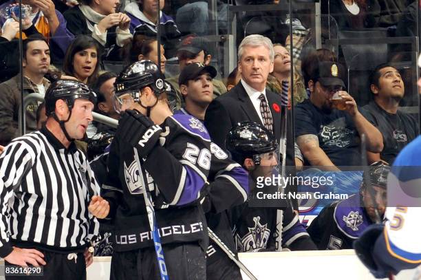 Head Coach Terry Murray of the Los Angeles Kings watches from he bench as Michal Handzus discusses a call with the referee during the game against...