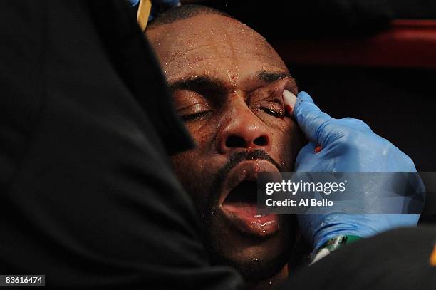 Roy Jones Jr's cut is tended to during the Ring Magazine Light Heavyweight Championship bout against Joe Calzaghe of Wales at Madison Square Garden...