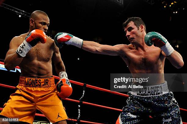 Joe Calzaghe punches Roy Jones Jr during their Ring Magazine Light Heavyweight Championship bout at Madison Square Garden November 8, 2008 in New...