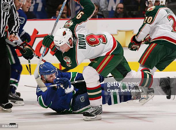 Mikko Koivu of the Minnesota Wild and Ryan Kesler of the Vancouver Canucks collide during their game at General Motors Place on November 8, 2008 in...