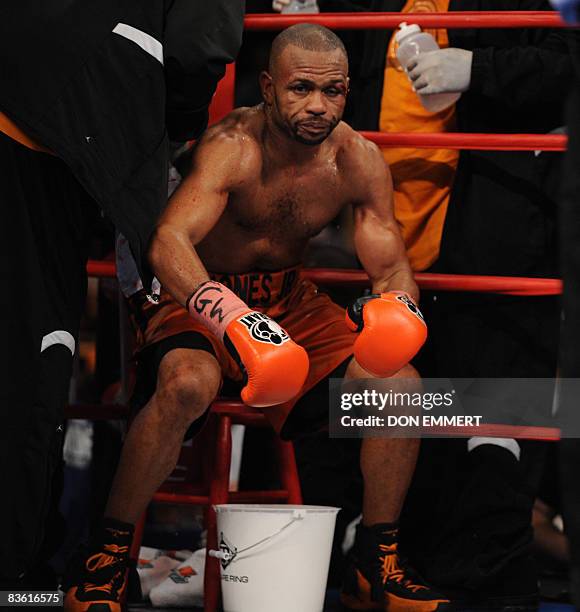 Bloodied Roy Jones Jr of the US is seated in his corner between rounds during his light-heavyweight showdown against Welshman Joe Calzaghe at Madison...