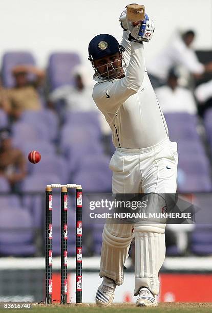 Indian cricketer Virender Sehwag plays a shot on the fourth day of the fourth and final Test match of the Border-Gavaskar Trophy 2008 series between...