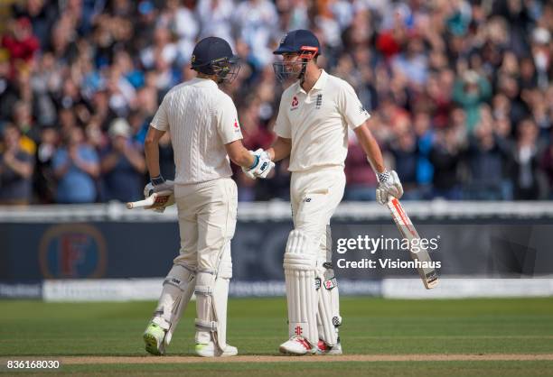 Alastair Cook of England celebrates reaching his double century and is congratulated by Dawid Malan during day two of the 1st Investec test match...