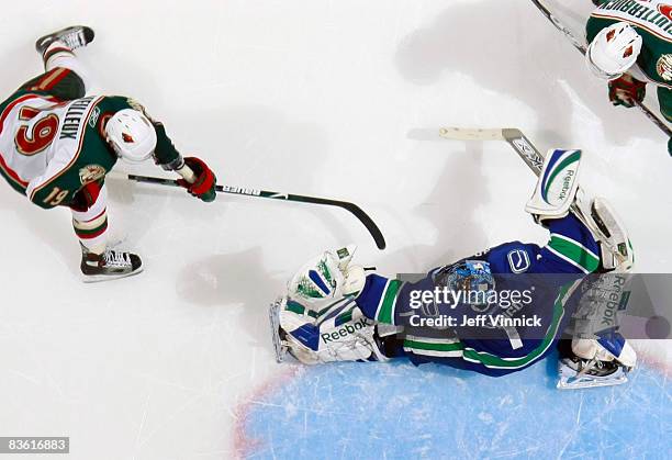 Roberto Luongo of the Vancouver Canucks makes a glove save off the shot of Stephane Veilleux of the Minnesota Wild during their game at General...