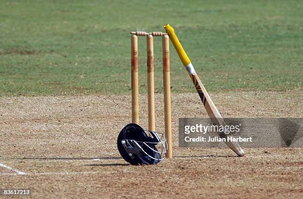 Helmet and bat rest against the stumps during Englands game against The Mubai Cricket Association during the first game of the winter Tour of India...