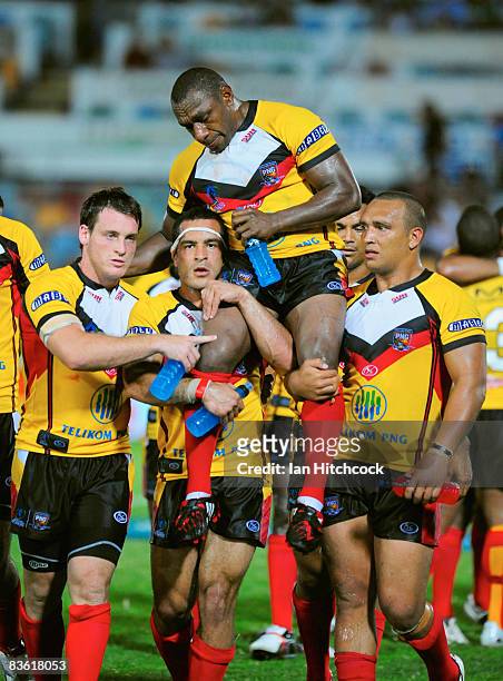 Stanley Gene of PNG is chaired off the ground by his teamamtes after the 2008 Rugby League World Cup Pool 1 match between Papua New Guinea and the...