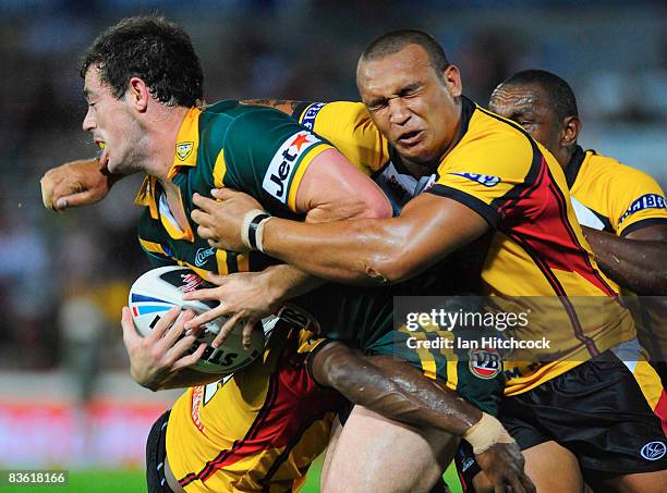 Neville Costigan of PNG hits Terry Campese of Australia during the 2008 Rugby League World Cup Pool 1 match between Papua New Guinea and the...