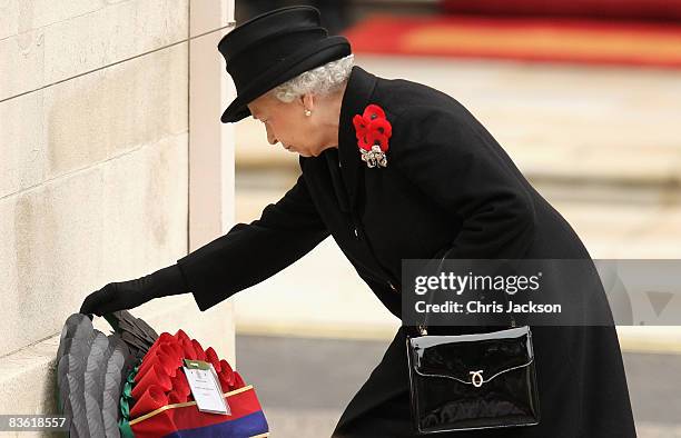 Queen Elizabeth II lays a wreath as she attends the Remembrance Sunday Service at the Cenotaph on November 9, 2008 in London, England. This year is...