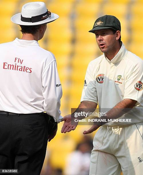 Australian cricketer Ricky Ponting gestures as he interacts with umpire Billy Bowden of New Zealand on the fourth day of the fourth and final test...