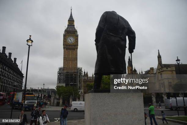 Elizabeth Tower, commonly known as Big Ben, is pictured with Winston Churchill's statue, the day of its last world famous 'bongs' for four years, in...