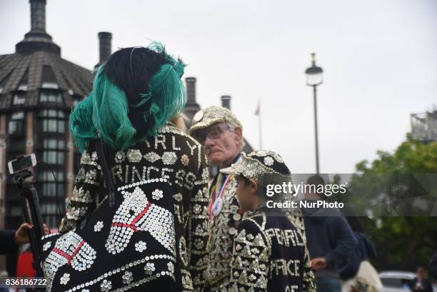 Pearly King, Queen and Prince are gathered at Parliament Square to hear the Big Ben's world famous 'bongs' for the final time for four years, in...