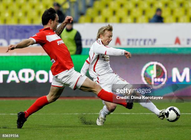 Martin Jiranek of FC Spartak Moscow fights for the ball with Renat Yanbayev of FC Lokomotiv Moscow during the Russian Football League Championship...