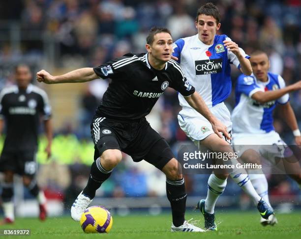 Frank Lampard of Chelsea is pressurised by Matt Derbyshire of Blackburn Rovers during the Barclays Premier League match between Blackburn Rovers and...