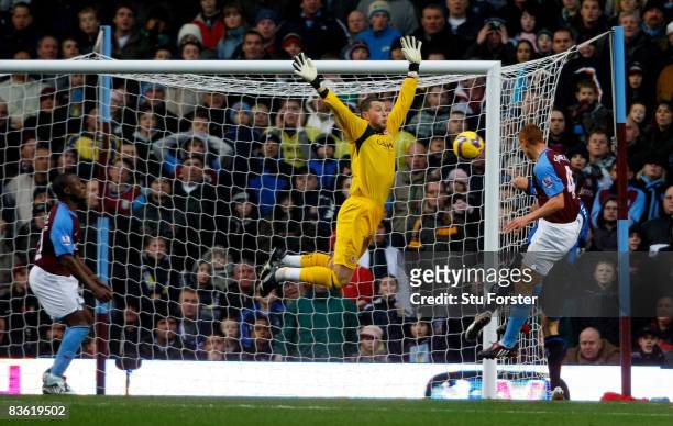 Aston Villa player Steve Sidwell heads past Middlesbrough goalkeeper Ross Turnbull to score the first Villa goal during the Barclays Premier League...