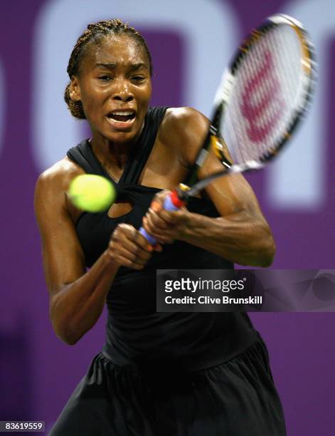 Venus Williams of the USA plays a backhand against Vera Zvonareva of Russia in the final during the Sony Ericsson Championships at the Khalifa Tennis...