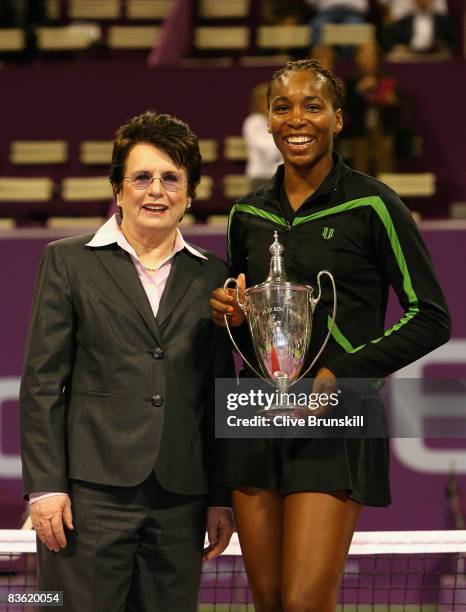 Venus Williams of the USA holds the Billie Jean King Cup whilst standing next to Billie Jean King after her three set victory against Vera Zvonareva...