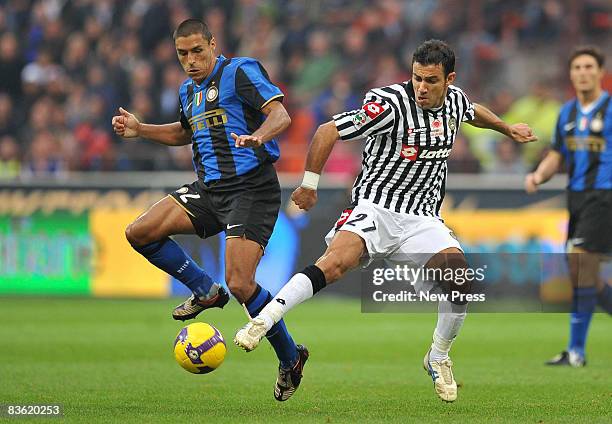 Ivan Cordoba of Inter and Fabio Quagliarella of Udinese in action during the Serie A match between Inter and Udinese at the Stadio Meazza on November...