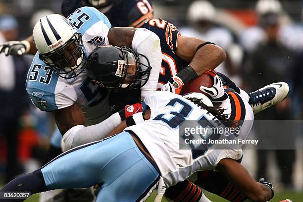 Keith Bulluck and Michael Griffin of the Tennessee Titans tackle Matt Forte of the Chicago Bears at Soldier Field on November 9, 2008 in Chicago,...